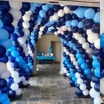 blue and white balloon arch tunnel