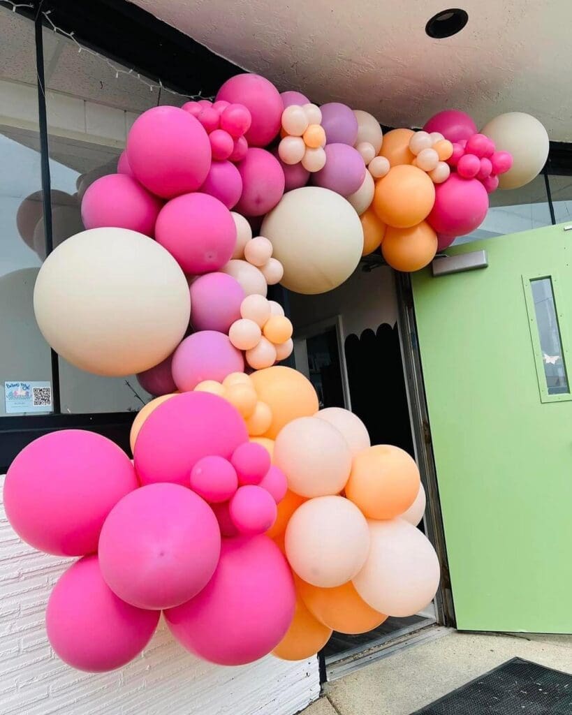 outdoor pink and orange organic balloon garland