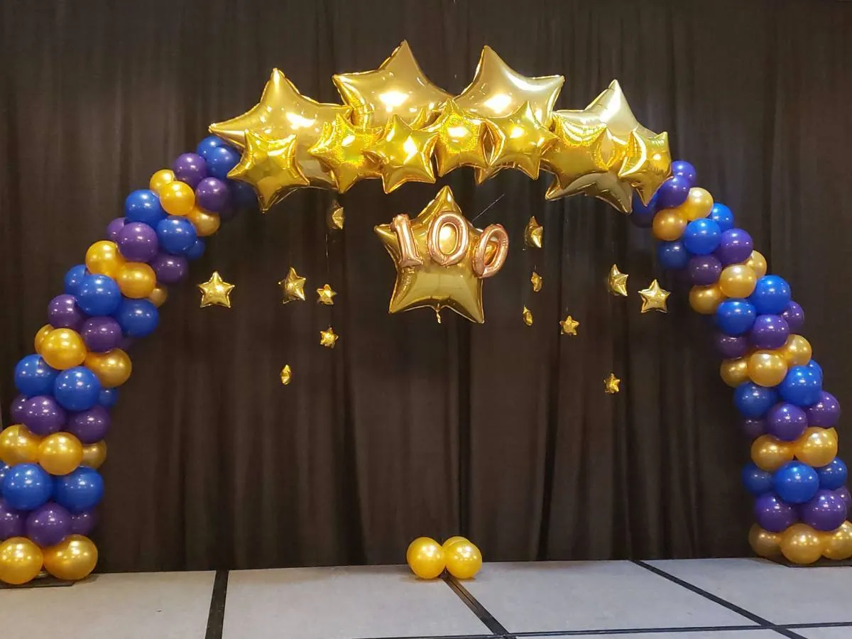 gold star balloon arch