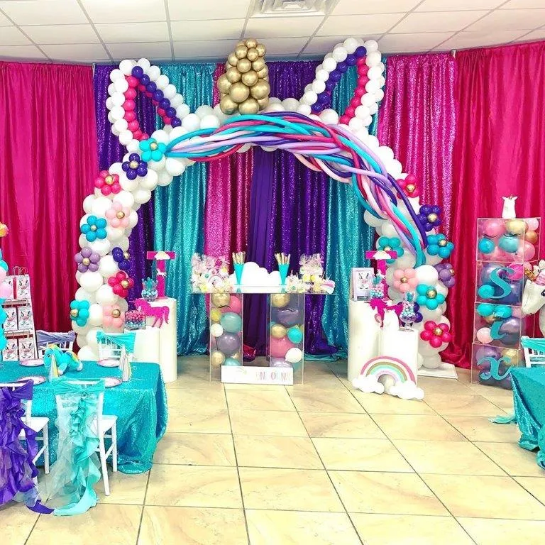 pink and purple indoor balloon decor installation for sixth birthday