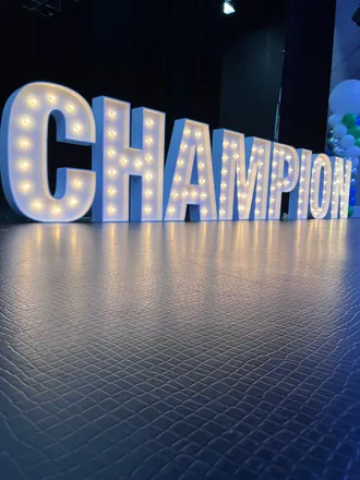 light up marquee spelling CHAMPION