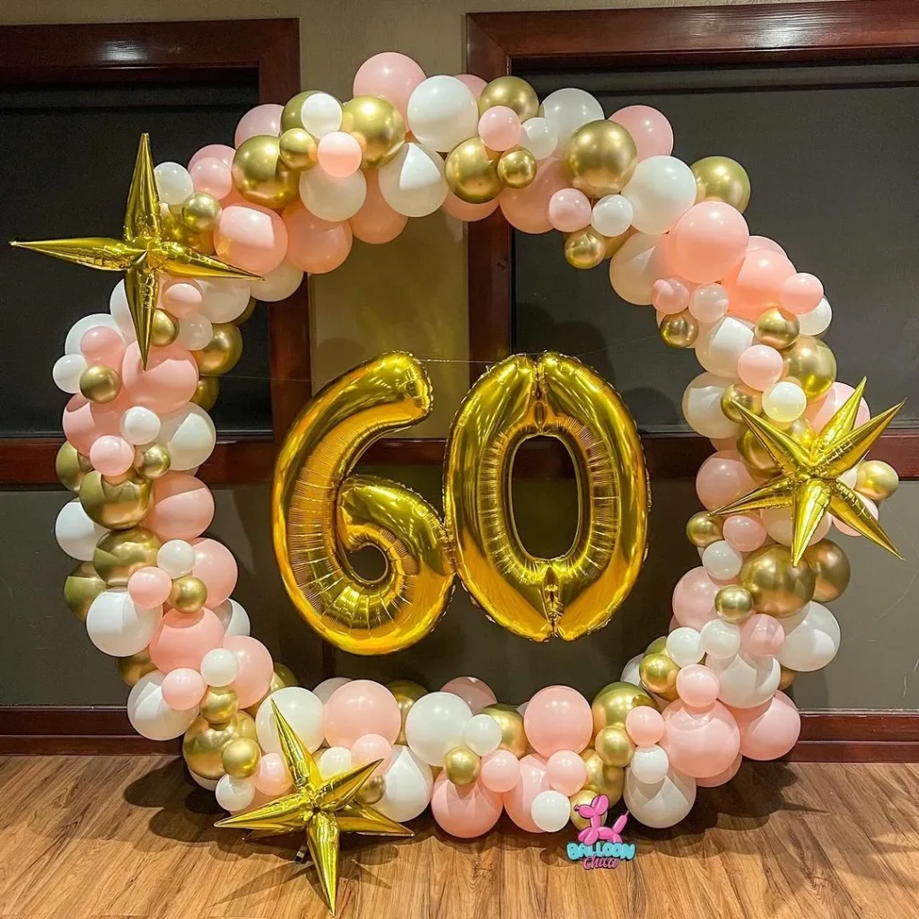 60th birthday circular balloon arch installation with foil balloons