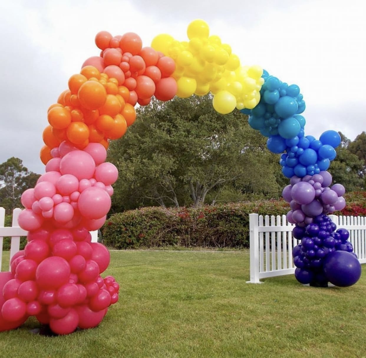 large colorful balloon arch set up outside