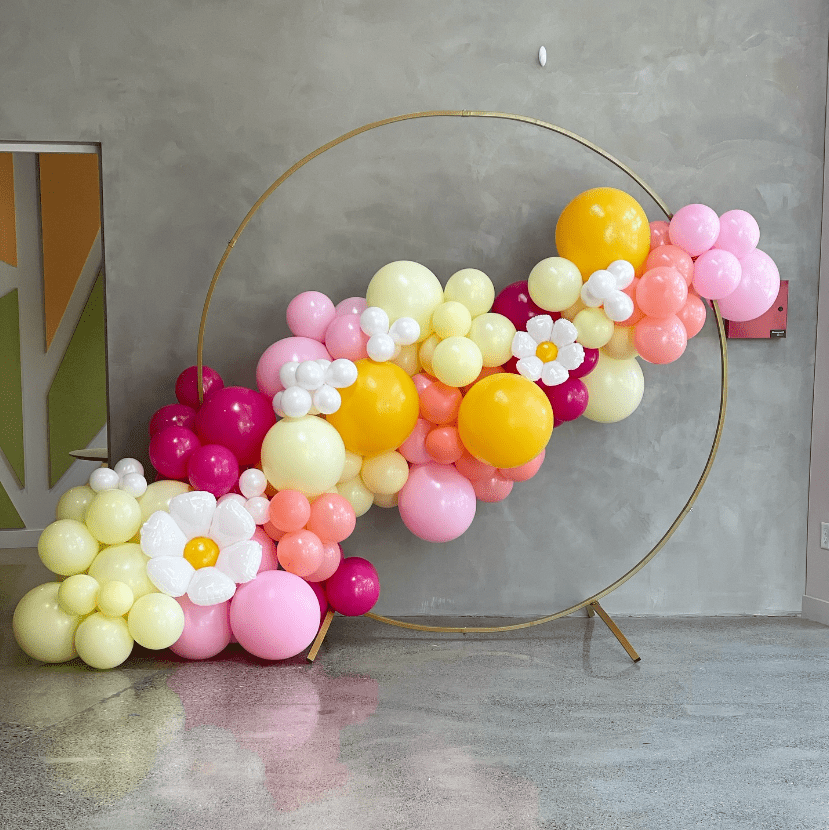 organic balloon garland backdrop with flowers