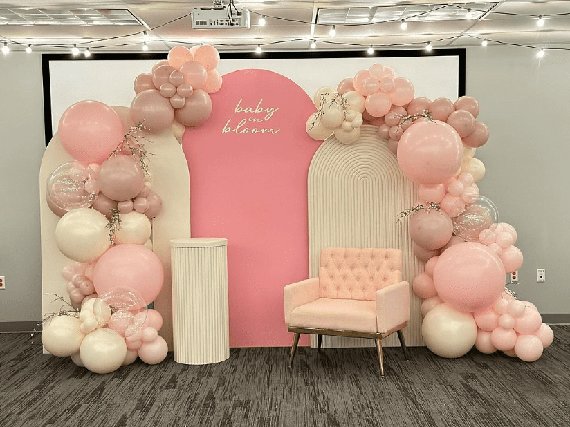 baby in bloom pink chiara wall arch backdrop with organic balloon garlands