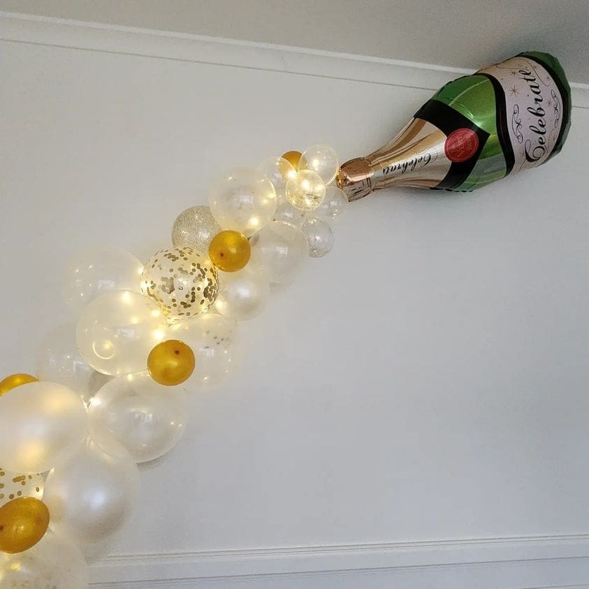 balloon decor wall installation of champaign bottle