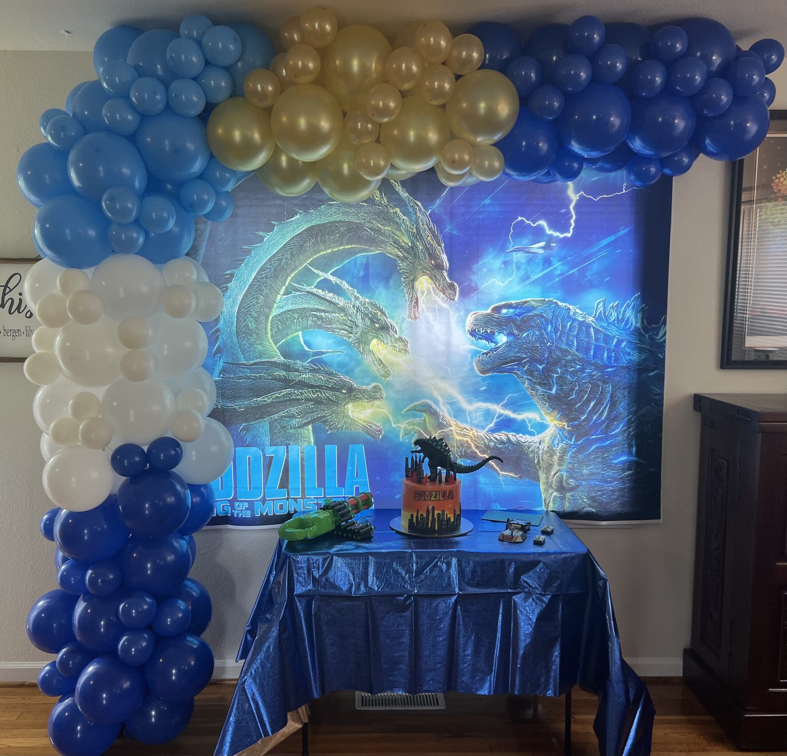 godzilla birthday with a balloon garland