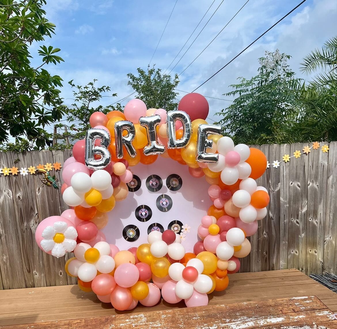 balloon decor backdrop that says BRIDE