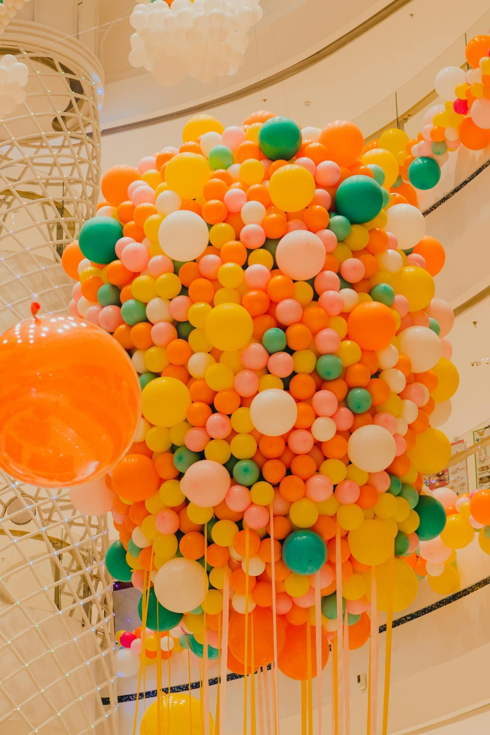 balloon drop with a large assortment of brightly colored balloons